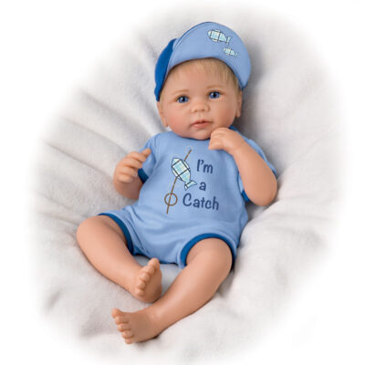 A baby doll wearing a blue hat and shirt.