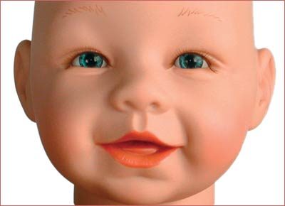 A baby doll with orange lips and blue eyes.