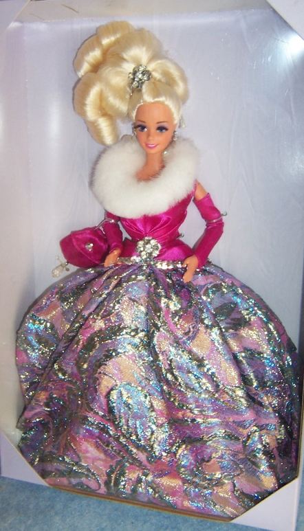 A barbie doll in a pink dress and white fur.