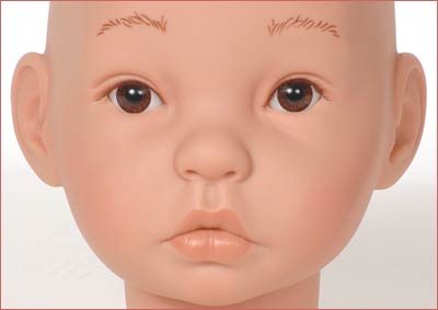 A close up of the face of an infant