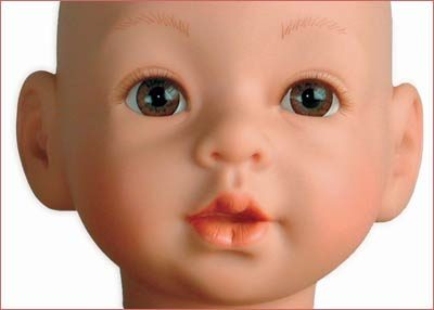 A close up of the face of a doll