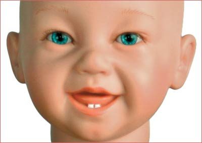 A baby doll with blue eyes and orange lips.