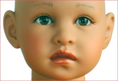 A close up of the face of a doll