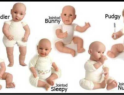 A baby is wearing all white and has different expressions.