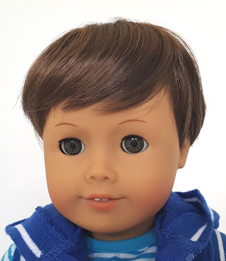 A close up of the face of an american girl doll