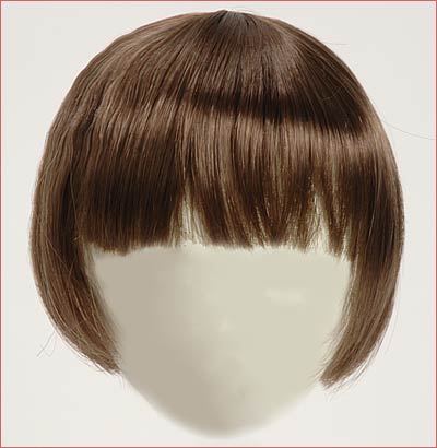 A brown wig with bangs on top of a white head.