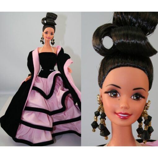 A barbie doll wearing a black and pink dress.