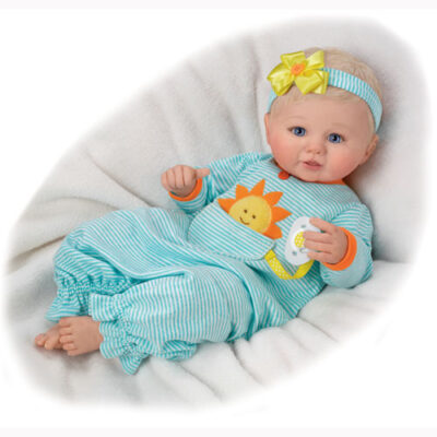 A baby doll wearing pajamas and headband