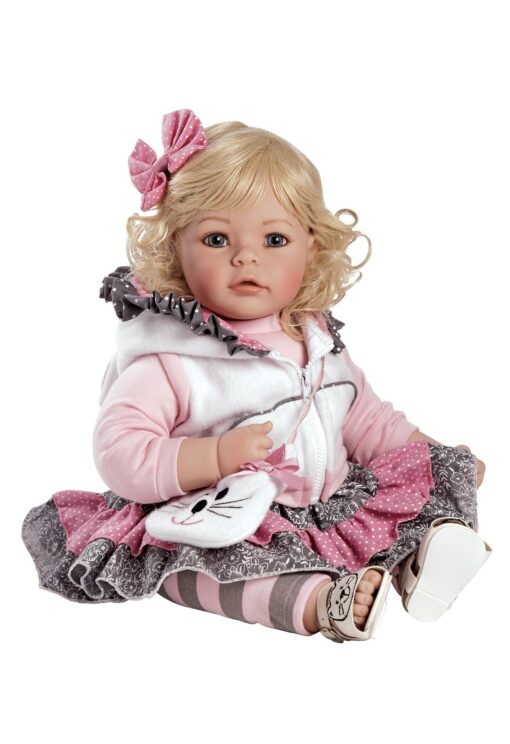 A doll that is sitting down and wearing clothes.